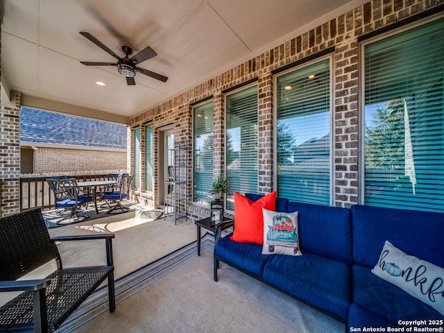 view of patio featuring an outdoor living space and ceiling fan