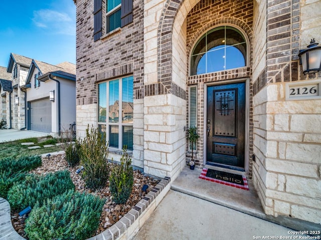 entrance to property featuring a garage