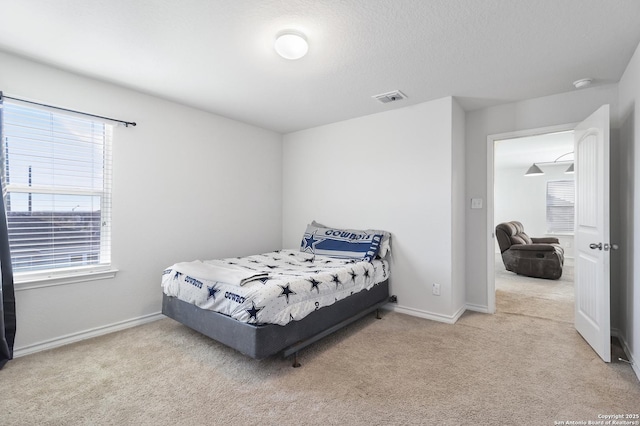 bedroom featuring light colored carpet