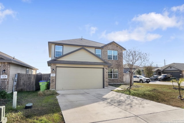 front facade featuring a front yard and a garage