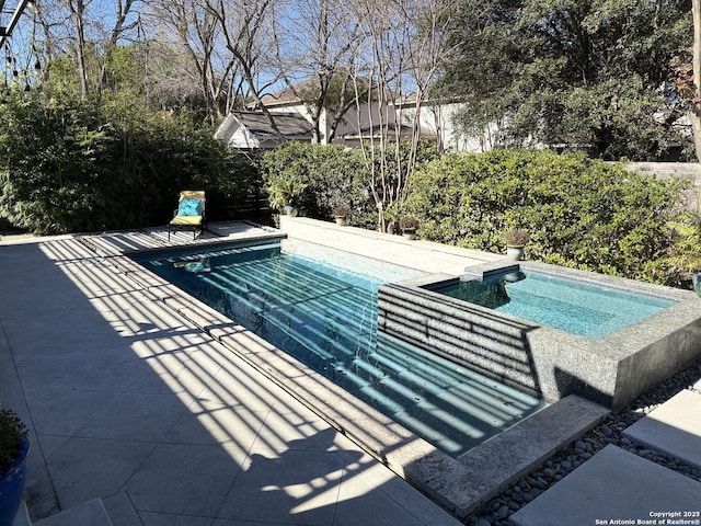 view of swimming pool featuring a patio