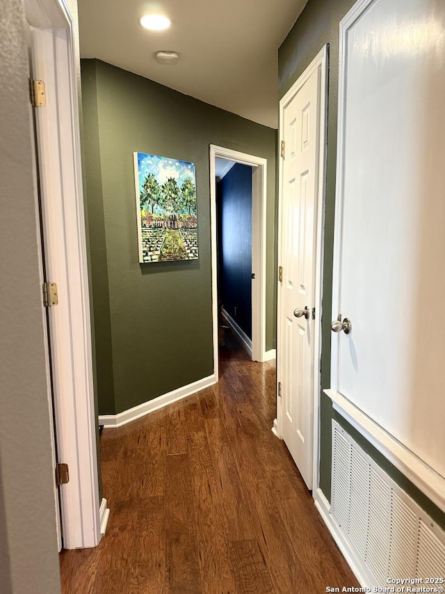 hall with dark hardwood / wood-style flooring