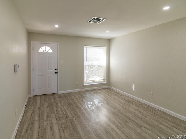 foyer with light hardwood / wood-style floors