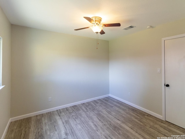 unfurnished room with light hardwood / wood-style flooring and ceiling fan