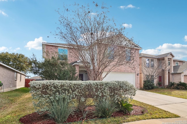 front facade featuring a garage and a front lawn