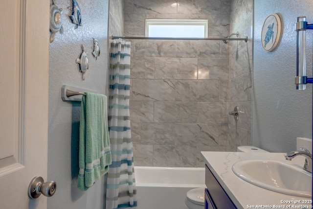 full bathroom with vanity, toilet, and shower / bath combo with shower curtain