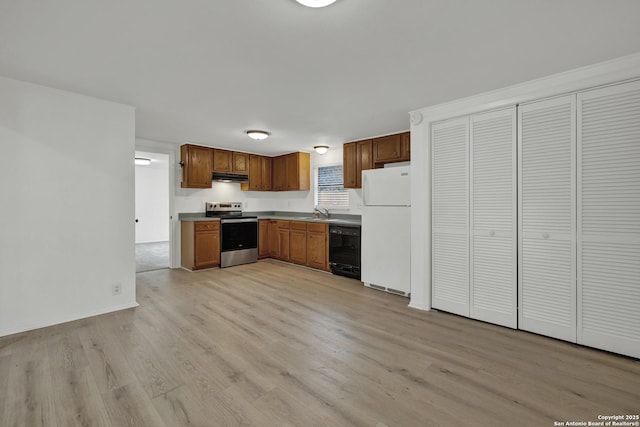 kitchen featuring electric stove, sink, black dishwasher, white fridge, and light hardwood / wood-style floors