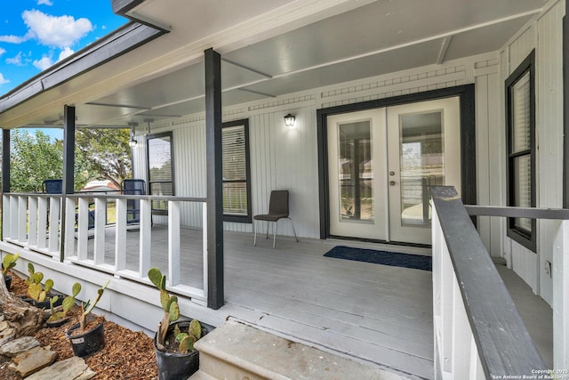 wooden terrace featuring french doors