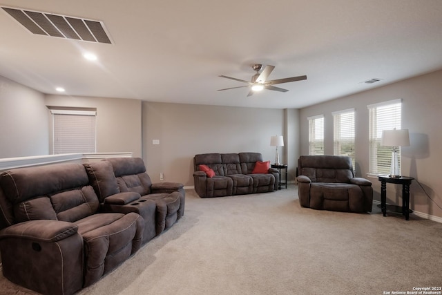 carpeted living room with recessed lighting, visible vents, ceiling fan, and baseboards