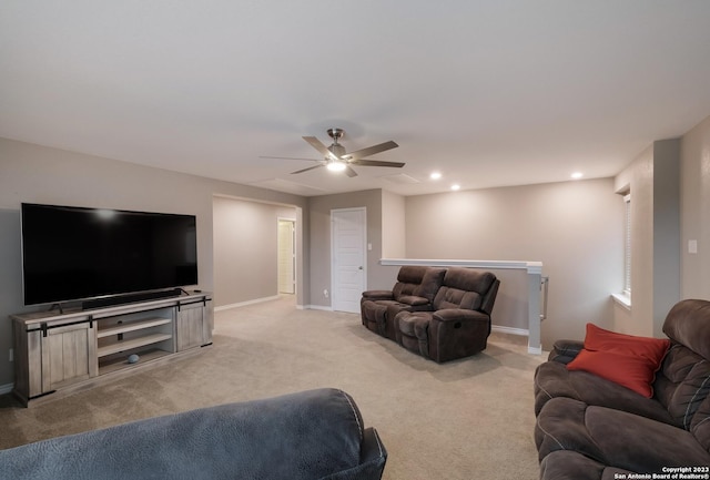 living room featuring baseboards, ceiling fan, recessed lighting, and light colored carpet