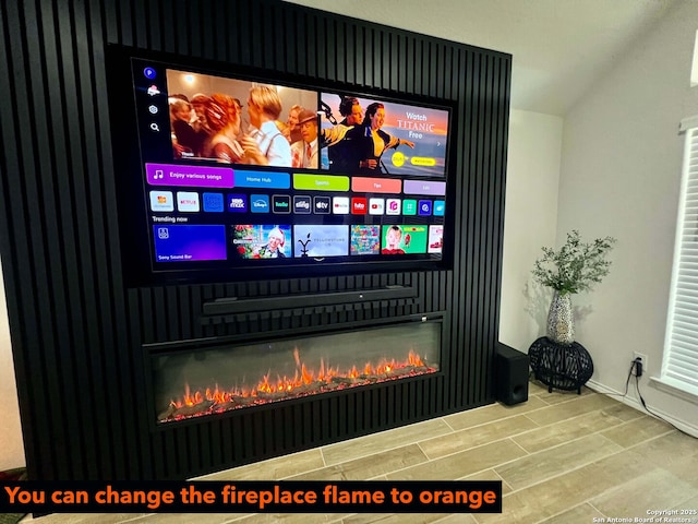 home theater room with hardwood / wood-style floors