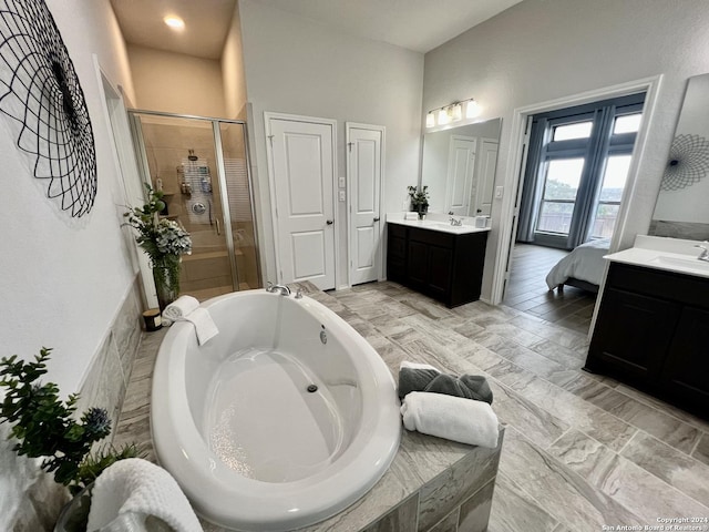 bathroom featuring vanity and plus walk in shower