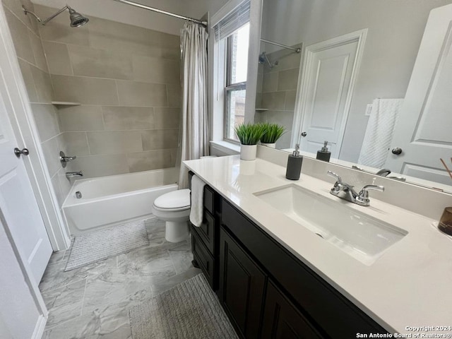 full bathroom with vanity, toilet, and shower / bath combo with shower curtain