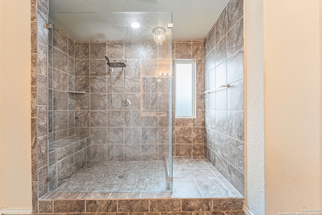 bathroom with tiled shower