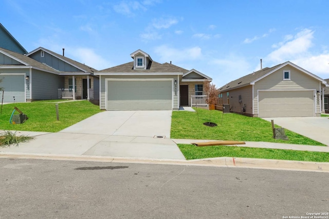 view of front of property with a front lawn and a garage