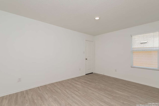 unfurnished room featuring light hardwood / wood-style flooring