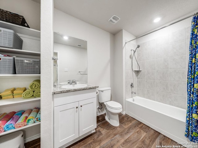 full bathroom with toilet, wood-type flooring, vanity, and shower / bath combo with shower curtain