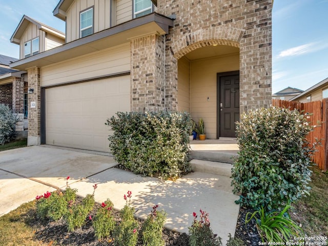 view of exterior entry with a garage