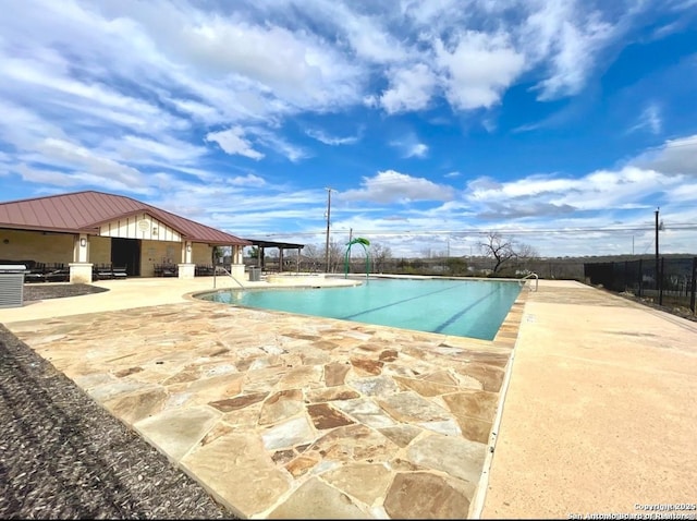 view of swimming pool with a gazebo and a patio