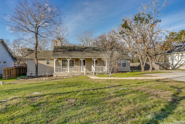 single story home with covered porch and a front lawn