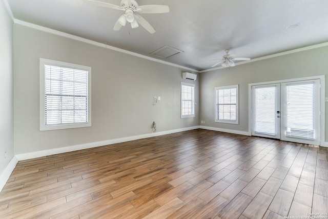 empty room with ceiling fan, crown molding, and a wall mounted AC