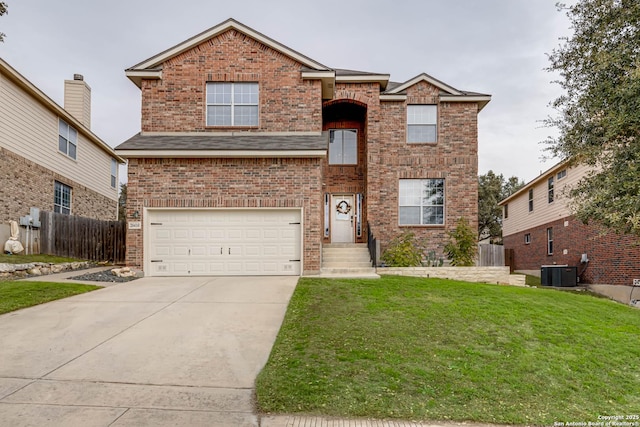 view of front property featuring cooling unit, a front yard, and a garage