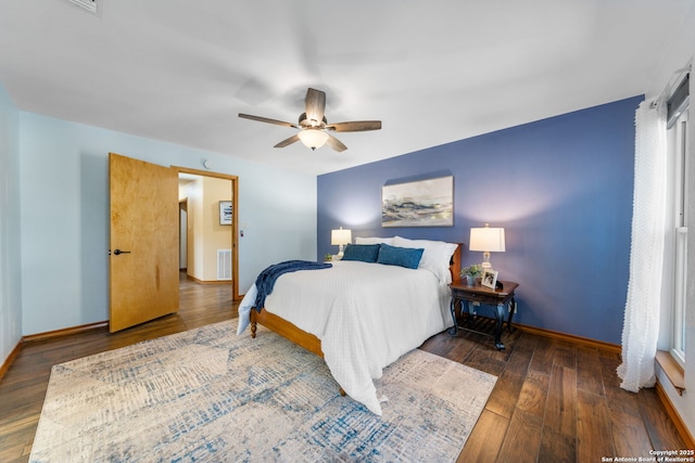 bedroom featuring dark wood-type flooring and ceiling fan