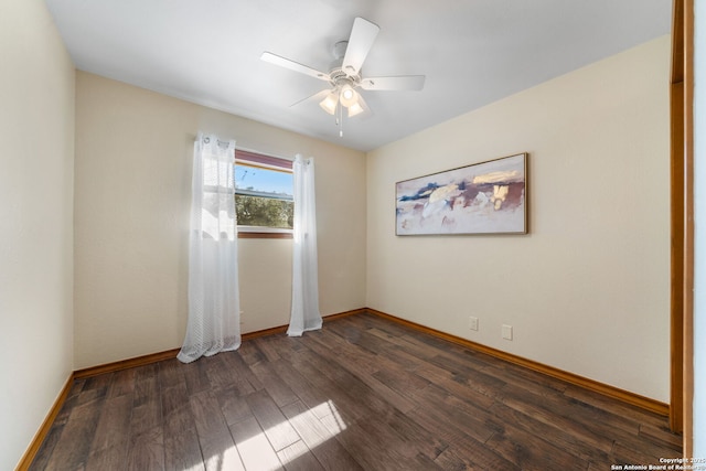 unfurnished room with ceiling fan and dark hardwood / wood-style flooring