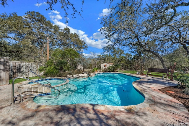 view of swimming pool featuring a patio area