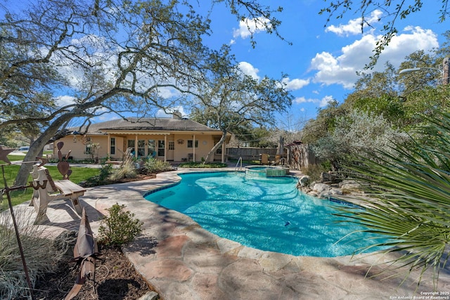 view of swimming pool with an in ground hot tub and a patio