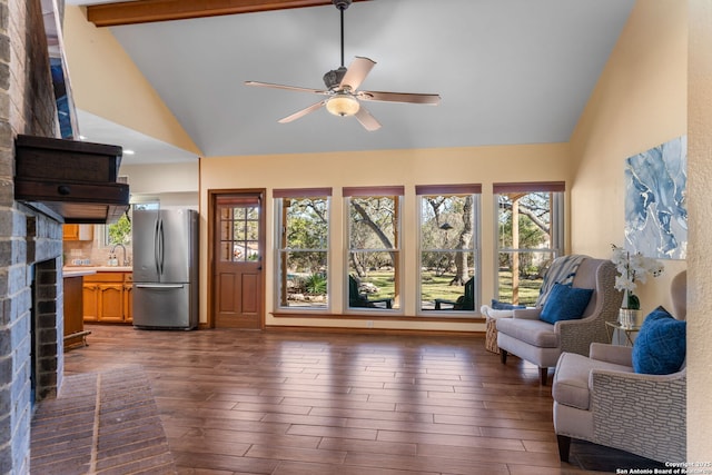 living room with plenty of natural light, dark wood-type flooring, and sink