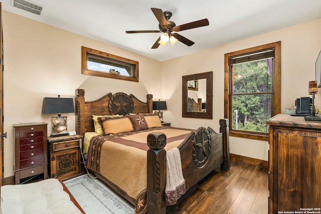 bedroom featuring ceiling fan and dark hardwood / wood-style floors