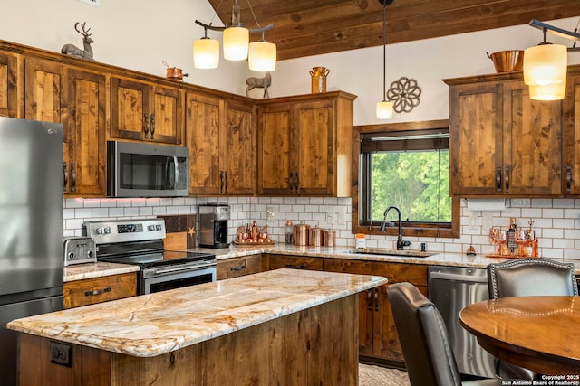 kitchen featuring sink, pendant lighting, and stainless steel appliances