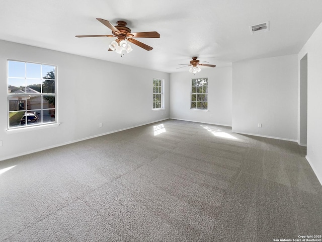 carpeted empty room featuring ceiling fan