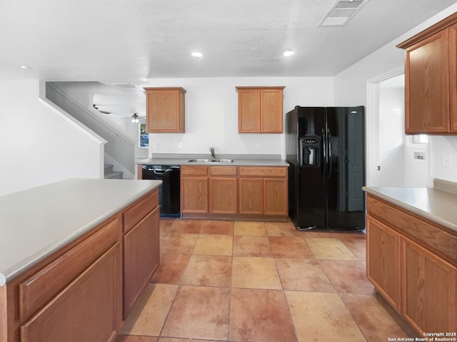 kitchen with black appliances, ceiling fan, sink, and light tile patterned floors