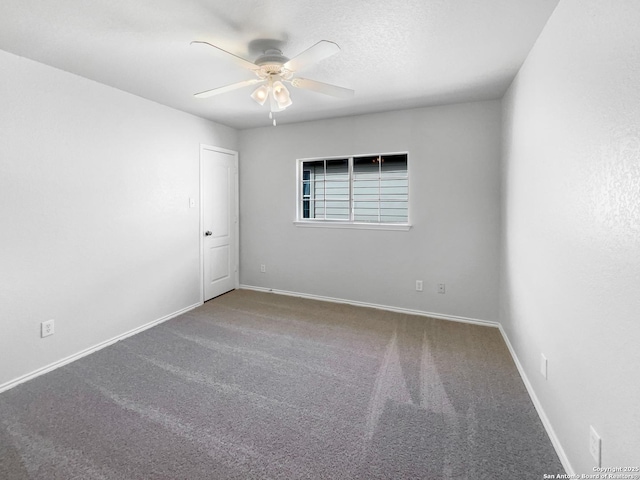 unfurnished room featuring a textured ceiling, ceiling fan, and carpet