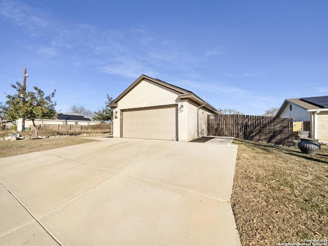 view of property exterior with a garage