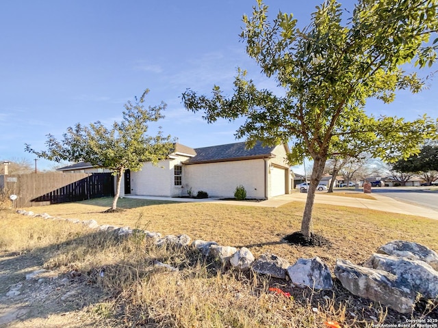 view of side of home with a garage