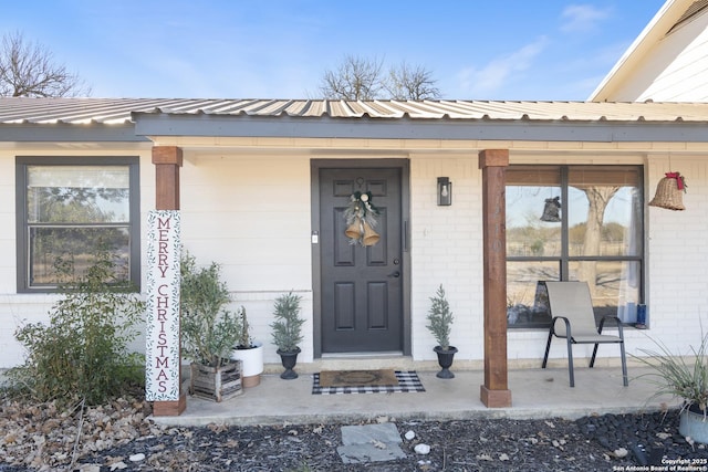 entrance to property with a porch