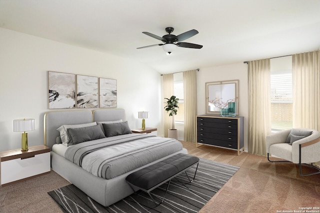 bedroom with ceiling fan and light colored carpet