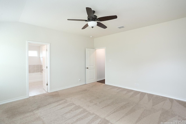 empty room with ceiling fan and light colored carpet