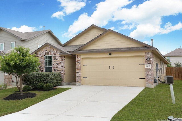 view of front of property featuring central AC unit, a front yard, and a garage