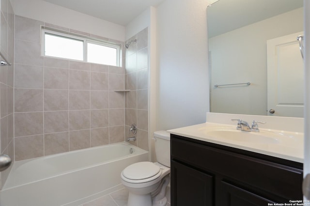 full bathroom with toilet, vanity, tiled shower / bath combo, and tile patterned floors