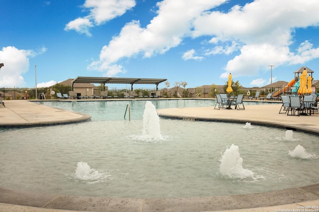 view of pool featuring pool water feature