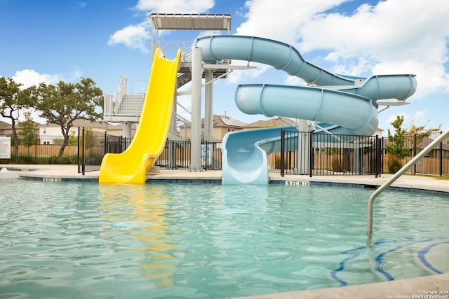 view of swimming pool featuring a water slide