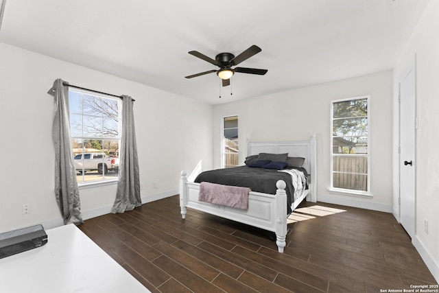 bedroom with multiple windows and ceiling fan