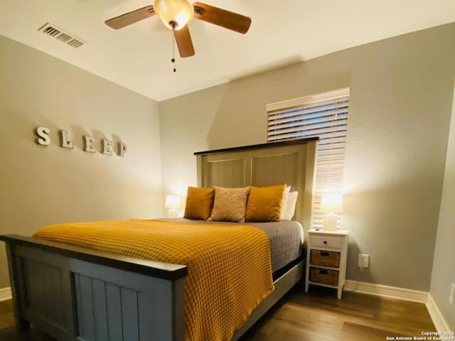 bedroom featuring ceiling fan and dark hardwood / wood-style flooring