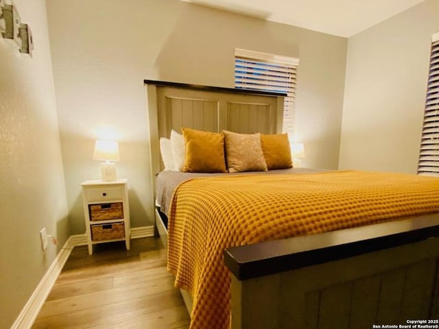 bedroom with light hardwood / wood-style floors