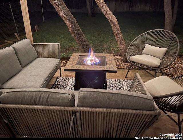 view of patio featuring an outdoor fire pit