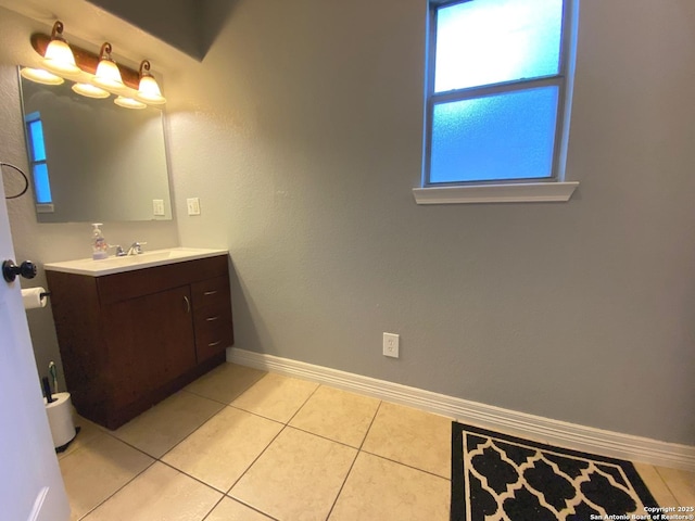 bathroom featuring tile patterned flooring and vanity